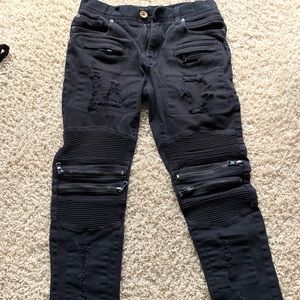 Black Ripped and zipper jeans.